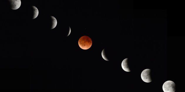 In this composite photograph the moon during various phases at the begining, middle and end of a total lunar eclipse April 15, 2014 as seen from Magdalena, New Mexico. While all of the event is visible from North and South America, sky watchers in northern and and eastern Europe, eastern Africa, the Middle East and Central Asia will be out of luck, according to NASA. AFP PHOTO/Stan HONDA (Photo credit should read STAN HONDA/AFP/Getty Images)