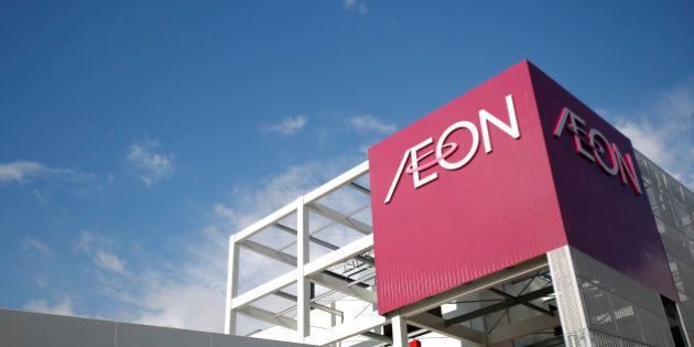Signage for Aeon Co. is displayed atop the Aeon Mall Makuhari Shintoshin shopping mall, operated by Aeon Mall Co., in Chiba, Japan, on Friday, Dec. 20, 2013. The mall opened today. Photographer: Kiyoshi Ota/Bloomberg via Getty Images