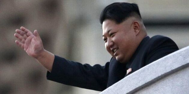 PYONGYANG, NORTH KOREA - OCTOBER 10: (CHINA OUT) North Korea's leader Kim Jong-Un waves from a balcony towards participants of a mass military parade at Kim Il-Sung square to mark the 70th anniversary of its ruling Worker's Party of Korea on October 10, 2015 in Pyongyang, North Korea. (Photo by ChinaFotoPress/ChinaFotoPress via Getty Images)