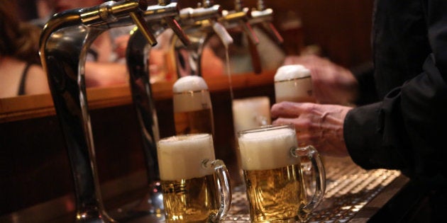 BERLIN, GERMANY - APRIL 22: A bartender serves beers at the Alt Berlin (Old Berlin) bar on April 22, 2014 in Berlin, Germany. The bar, which opened in 1893 and is known for its familial atmosphere, is claimed to be the oldest bar in the German capital, a city with few remaining pre-War drinking establishments in comparison to other major European cities. A petition has been launched to convince the bar's landlord to allow the business to stay open after its expected closure at the end of the month due to skyrocketing real estate prices in the city's popular and central Mitte neighborhood. (Photo by Adam Berry/Getty Images)