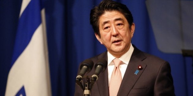 Japanese Prime Minister Shinzo Abe speaks during a press conference at a hotel in Jerusalem on January 20, 2015, demanding that the Islamic State group immediately free two Japanese hostages unharmed after the jihadists posted a video threat to kill them. The Islamic State group threatened to kill the two Japanese hostages unless Tokyo pays a $200 million ransom within 72 hours to compensate for non-military aid that Abe pledged to support the campaign against IS during an ongoing Middle East. AFP PHOTO / THOMAS COEX (Photo credit should read THOMAS COEX/AFP/Getty Images)