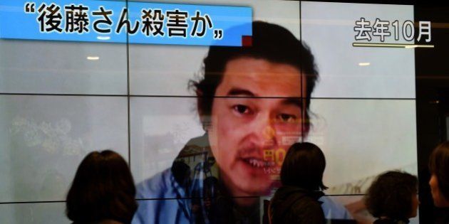 People walk past a big screen reporting that a Japanese hostage was killed by the Islamic State in Tokyo on February 1, 2015. Japan said it was 'outraged' after the Islamic State group released a video purportedly showing the beheading of Japanese hostage Kenji Goto. AFP PHOTO / Toru YAMANAKA (Photo credit should read TORU YAMANAKA/AFP/Getty Images)