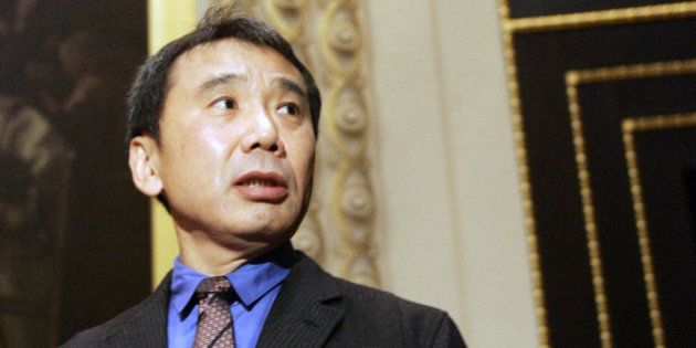 Novelist Haruki Murakami of Japan gestures during the ceremony for the Franz Kafka International Literary award hosted at the Prague's Old Town Hall, Czech Republic on Monday, Oct. 30, 2006. Murakami was chosen in March by an international jury which includes prominent German literary critic Marcel Reich-Ranicki and British publisher John Calder to win the annual Franz Kafka Prize, the Franz Kafka Society said. (AP Photo/Petr David Josek)