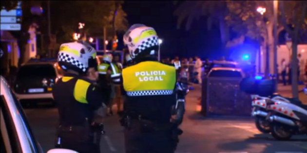 Officers investigate at the scene where police had killed four attackers in Cambrils, south of Barcelona, in this still image taken from Reuters video on August 18, 2017. REUTERS TV via REUTERS TPX IMAGES OF THE DAY