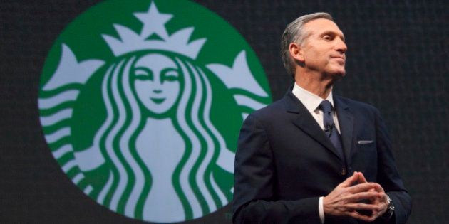 Starbucks Chief Executive Howard Schultz speaks during the company's annual shareholder's meeting in Seattle, Washington March 18, 2015. Starbucks Corp will begin offering delivery in New York City and Seattle later this year, when it also plans to expand mobile order and pay services across the United States. REUTERS/David Ryder (UNITED STATES - Tags: BUSINESS)