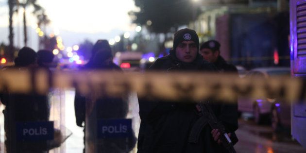 Turkish police officers secure the site of an explosion outside the courthouse in Izmir on January 5, 2017.A car bombing rocked the Turkish city of Izmir on January 5, 2016, killing at least two people and triggering a shootout that left two suspected militants dead, as authorities chased the fugitive killer behind the New Year attack in Istanbul. / AFP / EMRE TAZEGUL (Photo credit should read EMRE TAZEGUL/AFP/Getty Images)