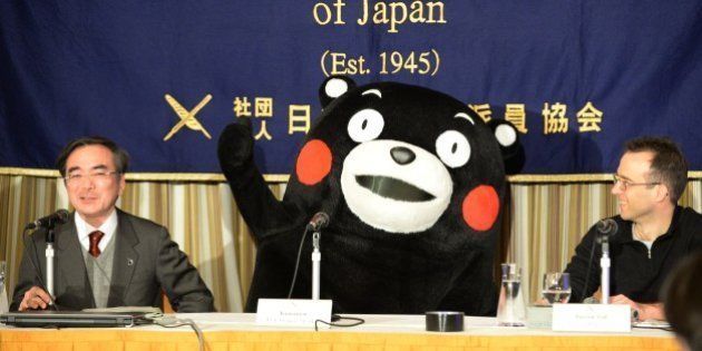 Kumamon gestures during a press conference at the foreign correspondents' club in Tokyo on February 14, 2014. A life-size bear mascot with red cheeks and no voice held a press conference in Tokyo on February 14, the latest public relations coup for the rural Japanese region he represents. AFP PHOTO / TOSHIFUMI KITAMURA (Photo credit should read TOSHIFUMI KITAMURA/AFP/Getty Images)