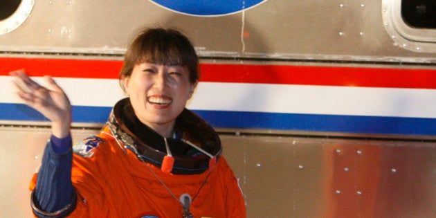 Astronaut of space shuttle Discovery, Mission Specialist Naoko Yamazaki of Japan, waves as she and the rest of the crew walk out of the Operations and Check-Out Building to be transported to launch pad 39a at the Kennedy Space Center, Monday, April 5, 2010, in Cape Canaveral, Fla. Discovery is scheduled to launch on a mission to the International Space Station. (AP Photo/Wilfredo Lee)