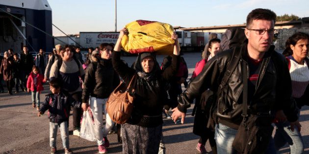 Migrants and refugees disembark from a ferry after their arrival from the Greek island of Lesbos at the Athens' port of Piraeus, Sunday, Oct. 4, 2015. The U.N. refugee agency is reporting a ânoticeable dropâ this week in arrivals of refugees by sea into Greece - as the total figure for the year nears the 400,000 mark. Overall, the UNHCR estimates 396,500 people have entered Greece via the Mediterranean this year with seventy percent of them are from war-torn Syria. (AP Photo/Yorgos Karahalis)