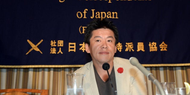 Former Livedoor president Takafumi Horie attends the FCC press conference in Tokyo on June 5, 2013. Horie, who was jailed for accounting fraud, said Japan's online landscape was prime territory for his aggressive style of business. AFP PHOTO / TOSHIFUMI KITAMURA (Photo credit should read TOSHIFUMI KITAMURA/AFP/Getty Images)