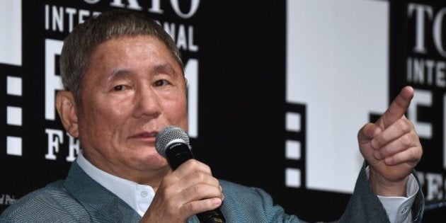 Japanese movie director Takeshi Kitano gestures as he answers questions after winning the first Samurai Award of the Tokyo International Film Festival during an event with young Japanese filmmakers in Tokyo on October 25, 2014. AFP PHOTO/Toru YAMANAKA (Photo credit should read TORU YAMANAKA/AFP/Getty Images)