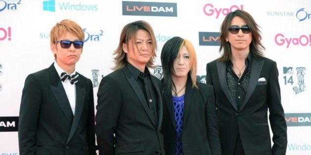 Members of Japanese rock group GLAY pose for photographers on the red carpet for the MTV Video Music Awards Japan 2014 in Urayasu, suburb of Tokyo, on June 14, 2014. AFP PHOTO/Toru YAMANAKA (Photo credit should read TORU YAMANAKA/AFP/Getty Images)