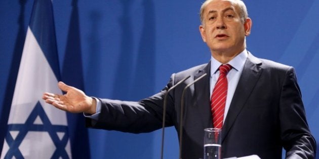 BERLIN, GERMANY - OCTOBER 21: Israeli Prime Minister Benjamin Netanyahu delivers a speech during a joint press conference with German Chancellor Angela Merkel (not seen) at the Chancellery on October 21, 2015 in Berlin, Germany. Netanyahu is in Berlin following the cancellation of German-Israeli government talks last week due to the security situation in Israel. (Photo by Mehmet Kaman/Anadolu Agency/Getty Images)