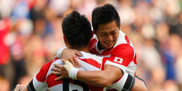 MILTON KEYNES, ENGLAND - OCTOBER 03: Kosei Ono (R) and Ayumu Goromaru of Japan celebrate victory after the 2015 Rugby World Cup Pool B match between Samoa and Japan at Stadium mk on October 3, 2015 in Milton Keynes, United Kingdom. (Photo by Stu Forster/Getty Images)