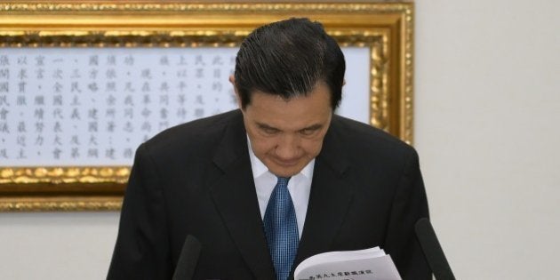 Taiwan President Ma Ying-jeou bows to resign as chairman of the ruling Kuomintang (KMT) in Taipei on December 3, 2014. Taiwan's Beijing-friendly President Ma Ying-jeou stepped down as chairman of the ruling party, following a massive polls defeat for the government as public fears grow over Chinese influence. AFP PHOTO / SAM YEH (Photo credit should read SAM YEH/AFP/Getty Images)