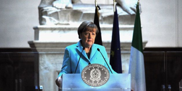 FLORENCE, ITALY - JANUARY 23: German Chancellor Angela Merkel speaks during a press conference inside the Galleria dell'Accademia in front of Michelangelo's statue of 'David' at the Florence Academy of Fine Arts on January 23, 2015 in Florence, Italy. The two leaders during this Italian German Bilateral Summit unusually held in Florence, instead of Rome, discussed a range of political and economic issues and plans of the two countries within the framework of the German Presidency of the G7. (Photo by Laura Lezza/Getty Images)