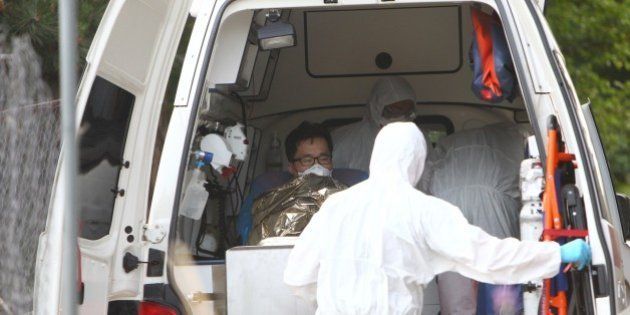 A South Korean patience suspected of suffering from Middle East Respiratory Syndrome (MERS) is admitted to Kramare hospital in Bratislava, Slovakia after the he was transported by medical staff from the Northern Slovak town of Zilina on June 13, 2015. AFP PHOTO / STRINGER (Photo credit should read STRINGER/AFP/Getty Images)