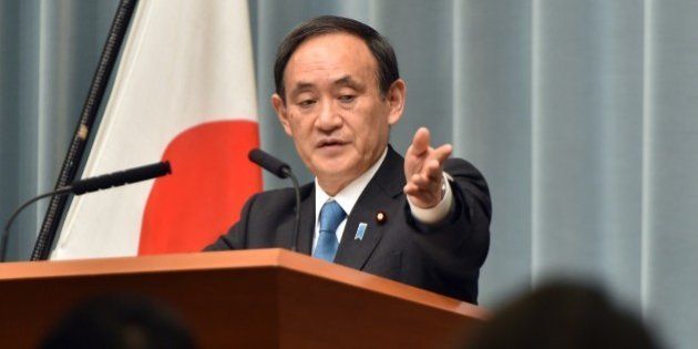 Japanese Chief Cabinet Secretary Yoshihide Suga speaks to reporters after a cabinet meeting at prime minister's official residence in Tokyo on January 27, 2015. Islamic State militants, who had killed one of the two Japanese hostages, dramatically changed their demand in the weekend from a ransom payment to the release of Sajida al-Rishawi, a would-be Iraqi female suicide bomber on death row in Jordan. AFP PHOTO / Yoshikazu TSUNO (Photo credit should read YOSHIKAZU TSUNO/AFP/Getty Images)
