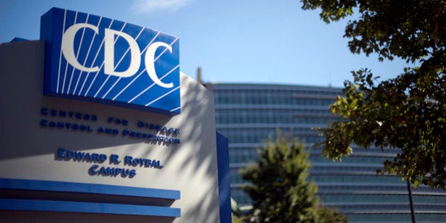 FILE - In this Oct. 8, 2013, file photo, a sign marks the entrance to the federal Centers for Disease Control and Prevention in Atlanta. Officials on Friday, Aug. 15, 2014, released the results of an internal probe into a deadly strain of bird flu that was accidentally mixed with a tamer strain. Unsuspecting scientists worked with the viral mix for months before it was discovered. (AP Photo/David Goldman, File)