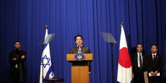 Japanese Prime Minister Shinzo Abe speaks during a press conference at a hotel in Jerusalem on January 20, 2015, demanding that the Islamic State group immediately free two Japanese hostages unharmed after the jihadists posted a video threat to kill them. The Islamic State group threatened to kill the two Japanese hostages unless Tokyo pays a $200 million ransom within 72 hours to compensate for non-military aid that Abe pledged to support the campaign against IS during an ongoing Middle East. AFP PHOTO / THOMAS COEX (Photo credit should read THOMAS COEX/AFP/Getty Images)