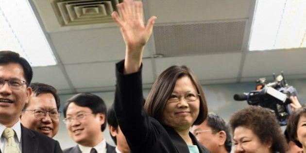 Tsai Ing-wen (C), chairwoman of Taiwan's main opposition Democratic Progressive Party (DPP), waves during a press conference in Taipei on April 15, 2015. The DPP announced on April 15 that Tsai will run for president in 2016 in the hope of becoming the island's first ever woman leader. AFP PHOTO / Sam Yeh (Photo credit should read SAM YEH/AFP/Getty Images)