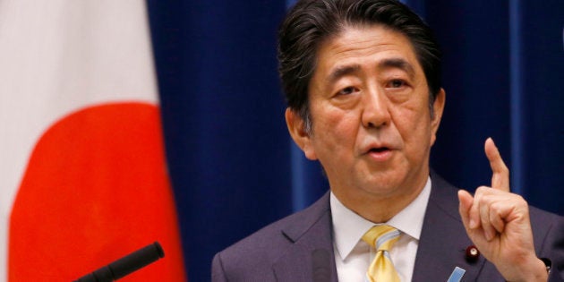 Japan's Prime Minister Shinzo Abe speaks during a press conference at his official residence in Tokyo, Thursday, May 14, 2015. Japan's Cabinet endorsed a set of defense bills Thursday that would allow the country's military to go beyond its self-defense stance and play a greater role internationally, a plan that has split public opinion. (AP Photo/Shizuo Kambayashi)