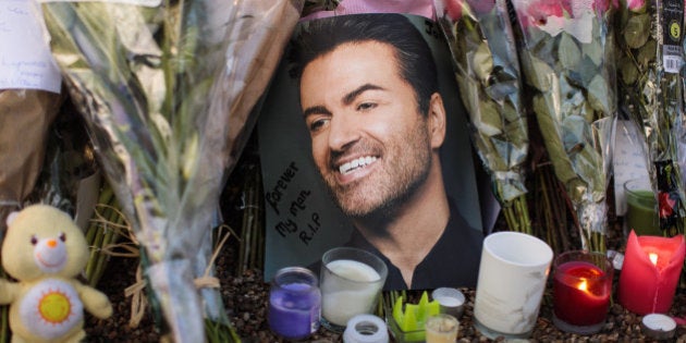 LONDON, ENGLAND - DECEMBER 28: Tributes of flowers, photographs and candles are left outside the home of pop music icon George Michael in The Grove, Highgate on December 28, 2016 in London, England. Singer George Michael died on Christmas day in his country home in Oxfordshire at the age of 53 on December 25. (Photo by Jack Taylor/Getty Images)