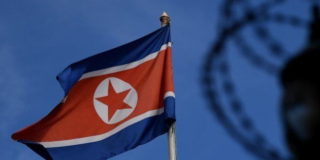 The North Korean flag is seen at mast past the barbed wire fencing of the North Korean embassy in Kuala Lumpur on March 27, 2017.The killing of the half-brother of North Korea's leader Kim Jong-Un last month in Kuala Lumpur International Airport with VX nerve agent triggered a bitter standoff between the previously friendly Asian nations, which have expelled each other's ambassador and refused to let their citizens leave. / AFP PHOTO / MANAN VATSYAYANA (Photo credit should read MANAN VATSYAYANA/AFP/Getty Images)