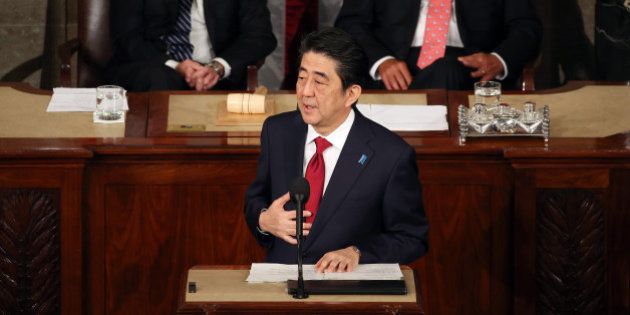 WASHINGTON, DC - APRIL 29: Japanese Prime Minister Shinzo Abe (C) speaks to a joint meeting of the US Congress while flanked by Vice President Joseph Biden (L) and House Speaker John Boehner (R-OH) (R) in the House chamber of the US Capitol April 29, 2015 in Washington, DC. e Prime Minister and his wife are on an official visit to Washington. (Photo by Mark Wilson/Getty Images)