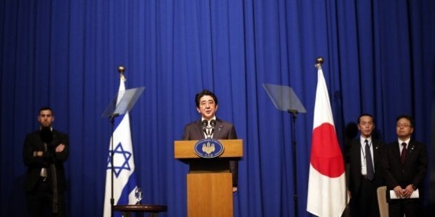 Japanese Prime Minister Shinzo Abe speaks during a press conference at a hotel in Jerusalem on January 20, 2015, demanding that the Islamic State group immediately free two Japanese hostages unharmed after the jihadists posted a video threat to kill them. The Islamic State group threatened to kill the two Japanese hostages unless Tokyo pays a $200 million ransom within 72 hours to compensate for non-military aid that Abe pledged to support the campaign against IS during an ongoing Middle East. AFP PHOTO / THOMAS COEX (Photo credit should read THOMAS COEX/AFP/Getty Images)