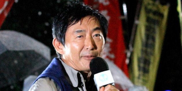 TOKYO, JAPAN - SEPTEMBER 17: Actor Junichi Ishida speaks during a protest against the new Japan Security Bill on September 17, 2015 in Tokyo, Japan. Hundreds of people gathered to protest against the security bills to expand the roles of Japan Self Defense Force. The scheduled committee vote, which is the second to last vote before the law officially being passed, has been repeatedly delayed by the opposition party. The ruling coalition party lawmakers are aiming to pass the legislation before the end of week. (Photo by MASASHI KATO/Getty Images)