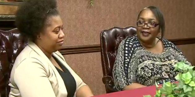 In this frame grab from video provided by WKBN-TV, La-Sonya Mitchell-Clark, left, sits next to her birth mother, Francine Simmons, during an interview, in Youngstown, Ohio. Mitchell-Clark's search for her birth mother yielded a surprising discovery, that they both work for the same company. (WKBN-TV via AP) MANDATORY CREDIT