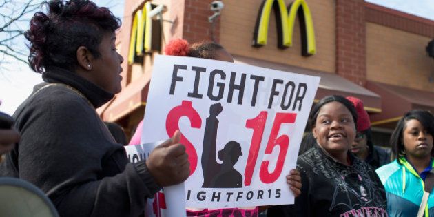 CHICAGO, IL - APRIL 15: Demonstrators gather in front of a McDonald's restaurant to call for an increase in minimum wage on April 15, 2015 in Chicago, Illinois. The demonstration was one of many held nationwide to draw attention to the cause. (Photo by Scott Olson/Getty Images)