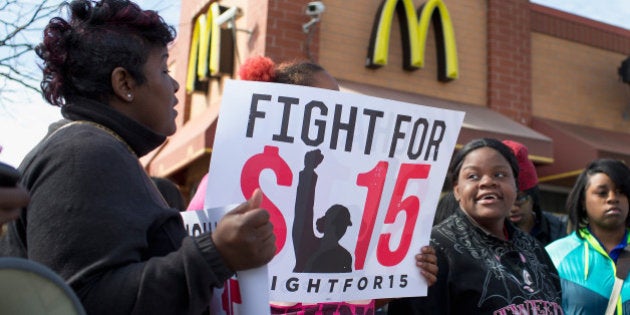 CHICAGO, IL - APRIL 15: Demonstrators gather in front of a McDonald's restaurant to call for an increase in minimum wage on April 15, 2015 in Chicago, Illinois. The demonstration was one of many held nationwide to draw attention to the cause. (Photo by Scott Olson/Getty Images)