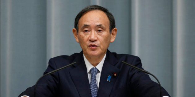 Japan's Chief Cabinet Secretary Yoshihide Suga speaks to the media during a press conference at Prime Minister's official residence in Tokyo, Wednesday, Feb. 10, 2016. Japan announced Wednesday that it would impose new sanctions on North Korea to protest a rocket launch seen as a test of missile technology. (AP Photo/Shizuo Kambayashi)