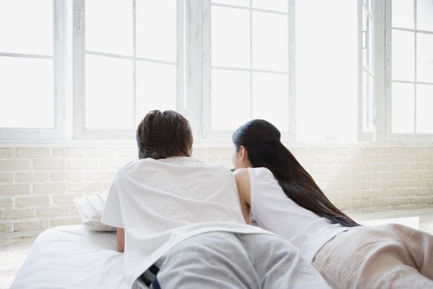 Couple lying on bed