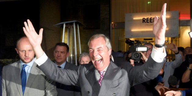 Nigel Farage, the leader of the United Kingdom Independence Party (UKIP), reacts at a Leave.eu party...