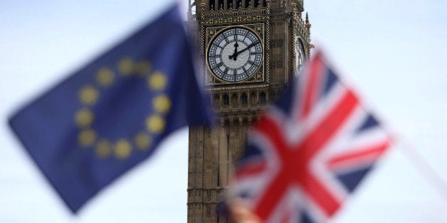 FILE PHOTO - Participants hold a British Union flag and an EU flag during a pro-EU referendum event at Parliament Square in London, Britain June 19, 2016. REUTERS/Neil Hall/File Photo TPX IMAGES OF THE DAY