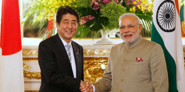 India's Prime Minister Narendra Modi, right, and Japan's Prime Minister Shinzo Abe shake hands before their talks at the state guest house in Tokyo Monday, Sept. 1, 2014. (AP Photo/Toru Hanai, Pool)