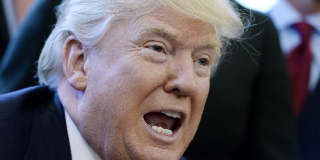 U.S. President Donald Trump speaks before signing an executive order in the Oval Office of the White House in Washington, D.C., U.S., on Friday, Feb. 24, 2017. Trump signed an executive order to impose additional oversight on government regulations, designating officials within government agencies who will monitor rule-making and identify needed policy changes, he said. Photographer: Olivier Douliery/Pool via Bloomberg