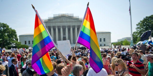 Hundreds of people gather outside the US Supreme Court building in Washington, DC on June 26, 2013 in anticipation of the ruling on California's Proposition 8, the controversial ballot initiative that defines marriage as between a man and a woman. The US Supreme Court on Wednesday struck down a controversial federal law that defines marriage as a union between a man and a woman, in a major victory for supporters of same-sex marriage.The Defense of Marriage Act (DOMA) had denied married gay and lesbian couples in the United States the same rights and benefits that straight couples have long taken for granted. AFP PHOTO / MLADEN ANTONOV (Photo credit should read MLADEN ANTONOV/AFP/Getty Images)