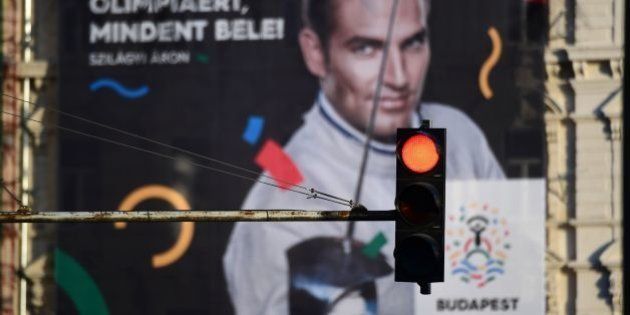 This picture taken on January 17, 2017 in Budapest shows a poster of Hungarian Olympic winner of sabre in Rio de Janeiro 2016 and London 2012, Aron Szilagyi, advertising Budapest's bid to host the 2024 Olympic Games . Budapest's bid to host the 2024 Olympic Games faces a new referendum challenge after a youth group critical of Prime Minister Viktor Orban said they will begin collecting signatures this week. / AFP / ATTILA KISBENEDEK (Photo credit should read ATTILA KISBENEDEK/AFP/Getty Images)