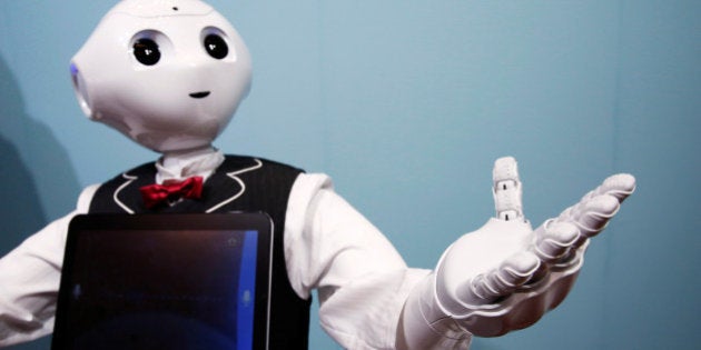 SoftBank humanoid robot known as Pepper dressed as a waiter moves its hand at Pepper World 2016 Summer during SoftBank World 2016 conference in Tokyo, Japan, July 21, 2016. REUTERS/Kim Kyung-Hoon