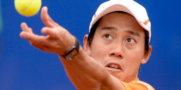 Japan's Kei Nishikori serves the ball to France's Jeremy Chardy during the ATP Barcelona Open 'Conde de Godo' tennis tournament in Barcelona on April 21, 2016. Nishikori won 3-6, 5-7. / AFP / JOSEP LAGO (Photo credit should read JOSEP LAGO/AFP/Getty Images)