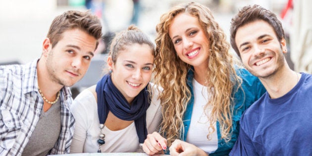 Group of Tourists Looking at Map