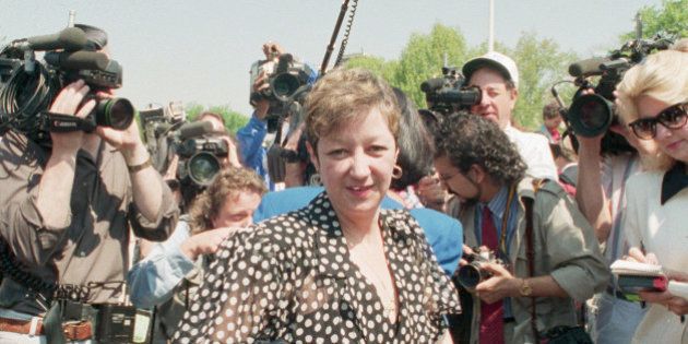 (Original Caption) 4/26/1989-Washington, D.C.- Norma McCorvey, 'Jane Roe' in Roe vs. Wade, is the center of media attention following arguments in a Missouri abortion case at the Supreme Court 4/26. McCorvey attended the session as a spectator. Photo shows McCorvey in front of Supreme Court steps talking to the press.
