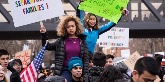 Thousands march down Jackson Boulevard towards Federal Plaza in support of immigrant rights in Chicago on February 16, 2017. This march was part of the 'A Day Without Immigrants' movement in which organizers across the United States asked immigrants to stay home from work and school and not spend any money to show how much they impact the economy. (Photo by Max Herman/NurPhoto via Getty Images)