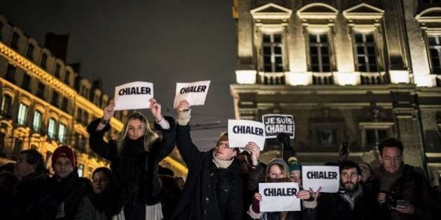 People hold placards reading in French 'weep' and 'I am Charlie' during a rally in Lyon, central-eastern France, on January 7, 2015, following an attack by unknown gunmen on the offices of the satirical weekly, Charlie Hebdo. France's Muslim leadership sharply condemned the shooting at the Paris satirical weekly that left at least 12 people dead as a 'barbaric' attack and an assault on press freedom and democracy. FP PHOTO / JEFF PACHOUD (Photo credit should read JEFF PACHOUD/AFP/Getty Images)