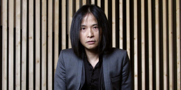 Japanese writer Hitonari Tsuji poses during the inauguration of the 32th Paris' book fair, on March 15, 2012 in Paris. The Paris' 2012 book fair which runs from March 16, 2012 to 19, will host 2,000 authors and 1,200 publishers from forty countries, with Japan and Moscow as guests of honours. AFP PHOTO FRANCOIS GUILLOT (Photo credit should read FRANCOIS GUILLOT/AFP/Getty Images)