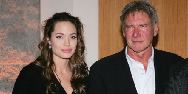 LOS ANGELES - DECEMBER 2: Actors Angelina Jolie and Harrison Ford attend the premiere of the United Artists film 'Hotel Rwanda' December 2, 2004 in Los Angeles, California. (Photo by Carlo Allegri/Getty Images)